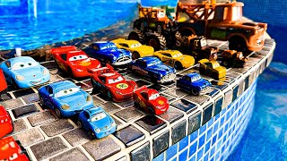 Disney Pixar Cars falling into deep pool, Lightning McQueen, Tow Mater, Mack, Sally, Francesco