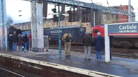 The Class 66 DB Cargo UK (Red Livery) with Rail Containers was passed through at Carlisle.