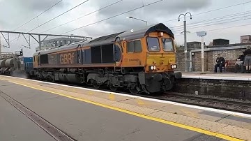 Class 66 66771 hauling a track cleaning unit at London Fields