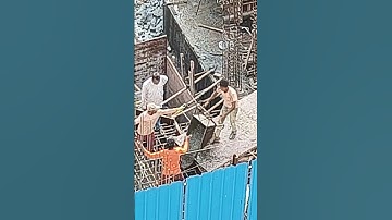 Worker quickly supplying concrete with wheelbarrow #construction #workers #concrete #wheelbarrow