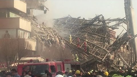 Many Iran firefighters feared trapped in building collapse