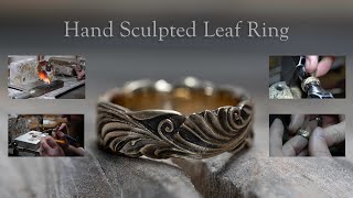 Hand making a sculpted leaf and scroll wedding ring.