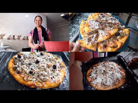 بيتزا بعجين رائع و سهل التحضير بدون دلك و حشوة لذيذة