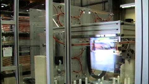 Side entry robotic de-mould of injection moulded coat hangers.