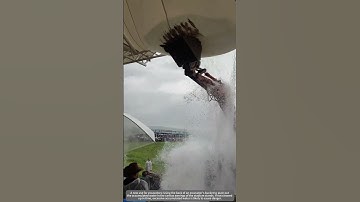 A new use for excavators: Removing accumulated water from the awnings of spectator stands