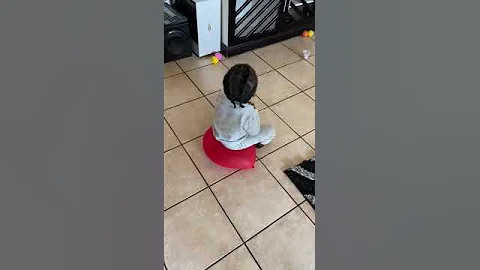 Toddler Using a Balloon as a Chair Pops It || ViralHog