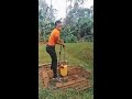 YOUNG LADY FETCHING WATER FROM THE WELL