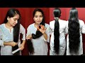 Dry hair combing and self haircut at the  bottom of the straight with long hair