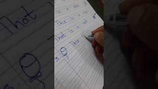 U.K.G English write the sentences using This or That