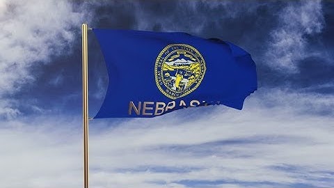 4K nebraska flag with title waving in the wind. Looping sun rises style. Animation loop Stock video