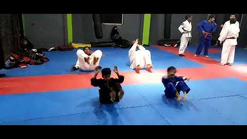 Junior Judokas performing, Judo Back Breakfall Ushiro Ukemi in Japanese 1