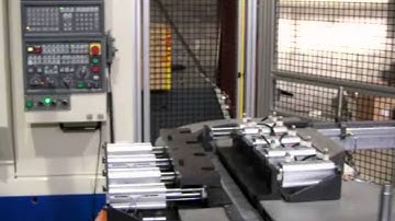 Fanuc M-16iB Robot Loads a Pair of Okuma VMC