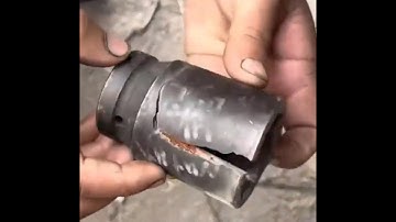 Expert mechanic demonstrates the process on a lathe to bring a broken air impact socket back to life