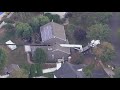 Crane falls onto home while delivering hot tub