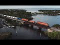 Aerial View: Florida East Coast Intermodal/Mixed Trains near Palm Bay Bridge and Cocoa