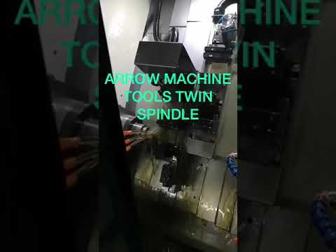 Twin spindle cnc lathe with barfeeder