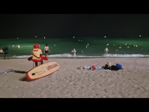 Dubai Umm Suqeim beach walk: Kite Beach night swim with flood light powered by solar +wind energy