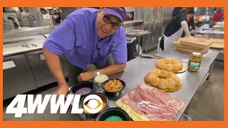 Chef Kevin Belton checks out Rouses' King Cake Muffuletta