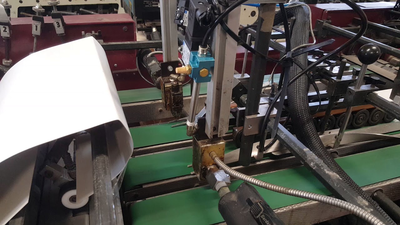 C4 wallet on 550 micron FBB being glued @Synergy Print Finishing