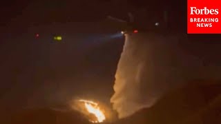 Firefighting Helicopters Drop Water On Kenneth Fire As Wildfires Continue To Burn In Los Angeles, CA