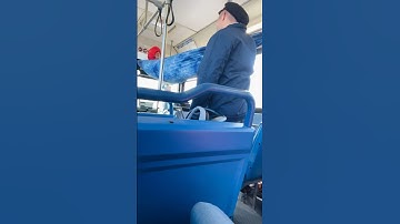 Guy set up a hammock on the bus.