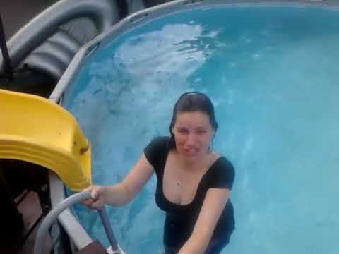 Wife jumping in pool off roof