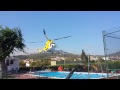 ANDRATX Helicopters getting water from a pool