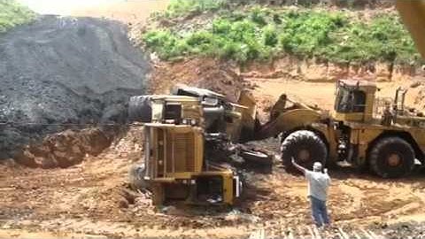 Cat scraper rollover