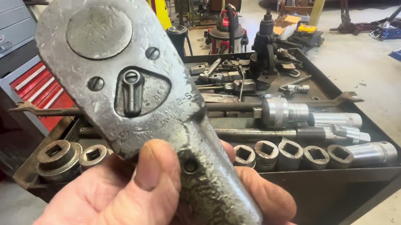 A tool box and tools mostly 1950 and before.