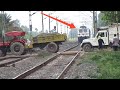 Crazy vehicles stop the train at unnamed level crossing & Gateman beaten by public