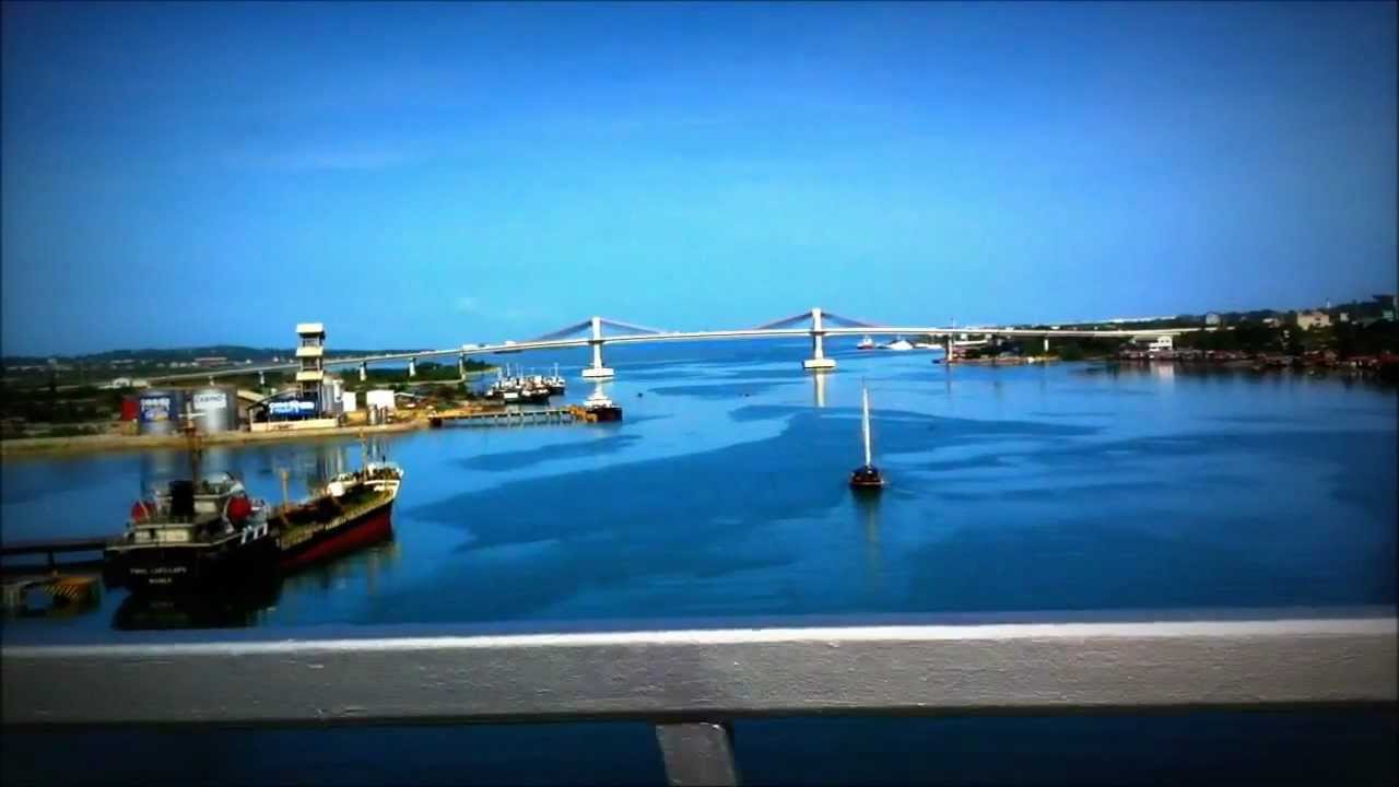 a nice boat passing under the Mactan Bridge