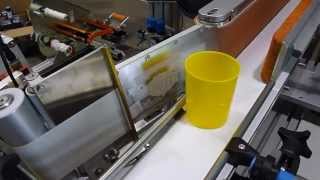 Labelling system for conic container
