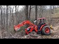 Building a road in a rock bar with the Kubota M6060.