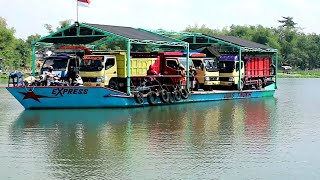 amazing ! small ships loaded with big trucks give you goosebumps