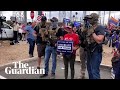 Armed Trump supporters gather outside vote count centre in Arizona