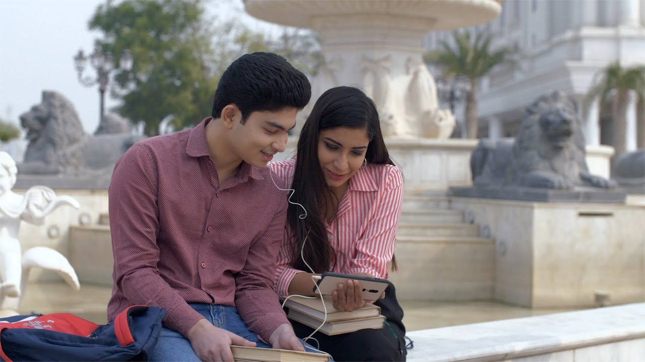 Cute Indian College Couple Enjoying Watching Movie Together On Indian Stock Footage Knot9