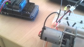 Arduino button + dc motor control example with Adafruit motor shield