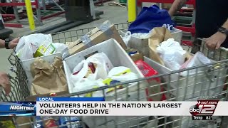 Volunteers collect donated food to help families in need
