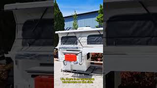 A motorhome with a pop-up roof, ready to be shipped overseas