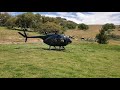 Hughes 500C turbine helicopter take off.