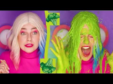 CC2 - Harley Quinn hair gunged with green broccoli slime - A clip from a colourful channel, with a young woman with Harley Quinn hair getting gunged with smelly broccoli slime while sitting in a mystery buttons box.