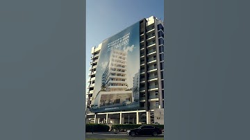 Real or CGI? Huge Roll-Up Banner Spreads Over Building