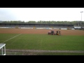 Sports pitch maintenance applying sand top dressing to a football pitch