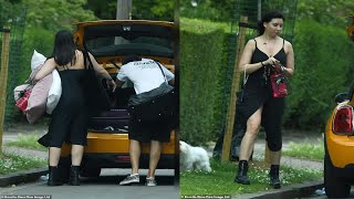 Daisy Lowe wears black dress with thigh-split and chunky boots as she enjoys a picnic in the park wi