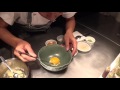 Preparation of the signature egg yolk dish at locavore