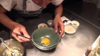 Preparation of the signature egg yolk dish at Locavore