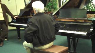 09   Christian trying out Steinway piano 2