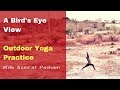 Birds eye view of an outdoor yoga practice with samrat pasham