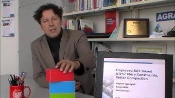 ICCAD 2013: Rolf Drechsler introduces "Improved SAT-based ATPG: More Constraints Better Compaction".