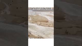 Toyota pickup barely escapes flash flood